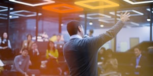 Male speaker talking to an audience of entrepreneurs