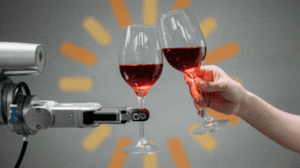 A robot and human cheers each other with wine glasses