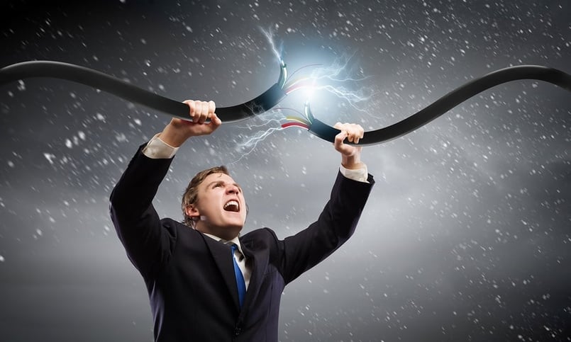 bigstock-Young-businessman-tearing-elec-67545910.jpg