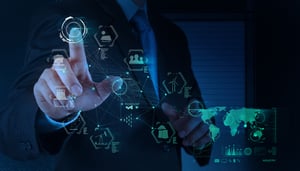 Business man in a suit touching a screen showing various online tools