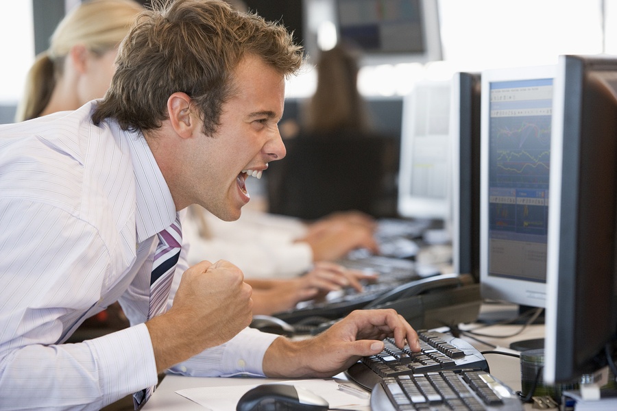 bigstock-Stock-Trader-Overjoyed-Looking-13900406